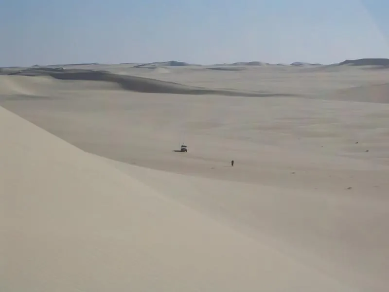 Drone engineer testing an industrial drone in desert terrain