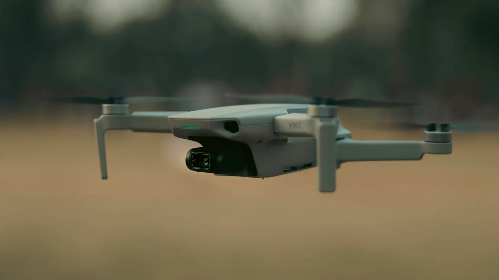 Small multirotor carrying a micro gimbal on a low-altitude test flight to verify power margin and thermal behavior